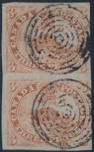 Lot 15, Canada 1851 three penny red Beaver VF used vertical pair on laid paper